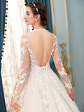A-line Tulle Lace Applique Wedding Dresses Beaded Luxurious Floor Length Long Sleeve